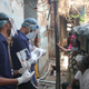 Asha warriors speak to the elderly to promote vaccination.